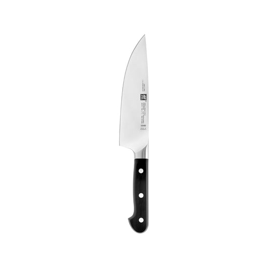 Chef’s Knife on a cutting board with sliced roasted pumpkin – premium stainless steel blade and ergonomic handle.