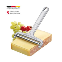 Angled view of Westmark Germany stainless steel wire cheese slicer showing ergonomic handle and fine cutting wire for smooth and even cheese slices.