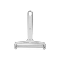 Westmark Germany stainless steel wire cheese slicer placed on a block of cheese with grapes and tomatoes, showing sharp cutting precision and ergonomic handle design.